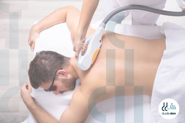 Male receiving laser hair removal treatment