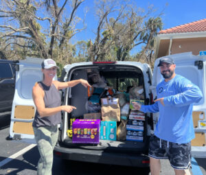 Packing items in van for hurricane relief