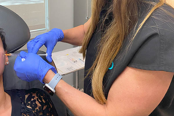 Sculptra injections performed by FIBB master injector on patient